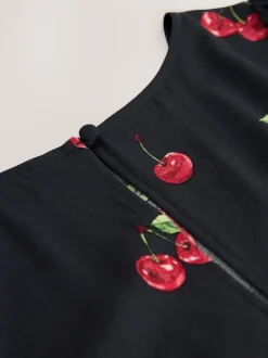 Noir imprimé cerises - Mini robe à manches longues avec coutures
