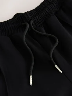 Noir/Neutre - Pantalons de survêtement Slinky à jambes Amples et rayures latérales